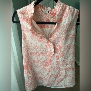 Floral sleeveless top with ruffled collar